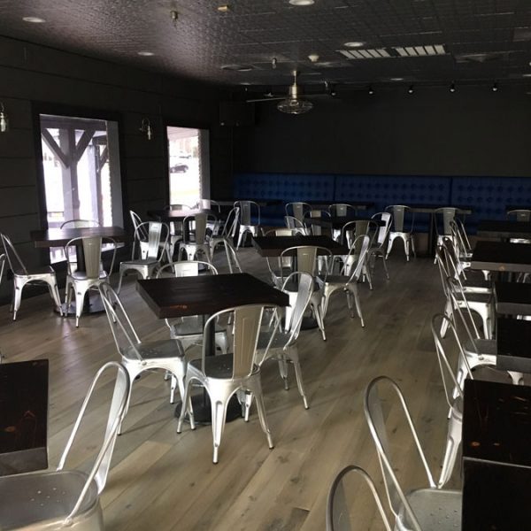 The interior of J&R's Steakhouse with Longhorn hardwood floors.