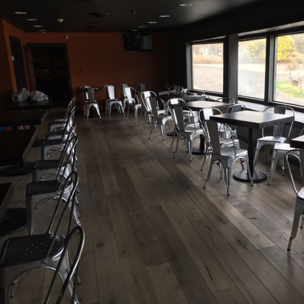 The interior of J&R's Steakhouse with Longhorn hardwood floors.