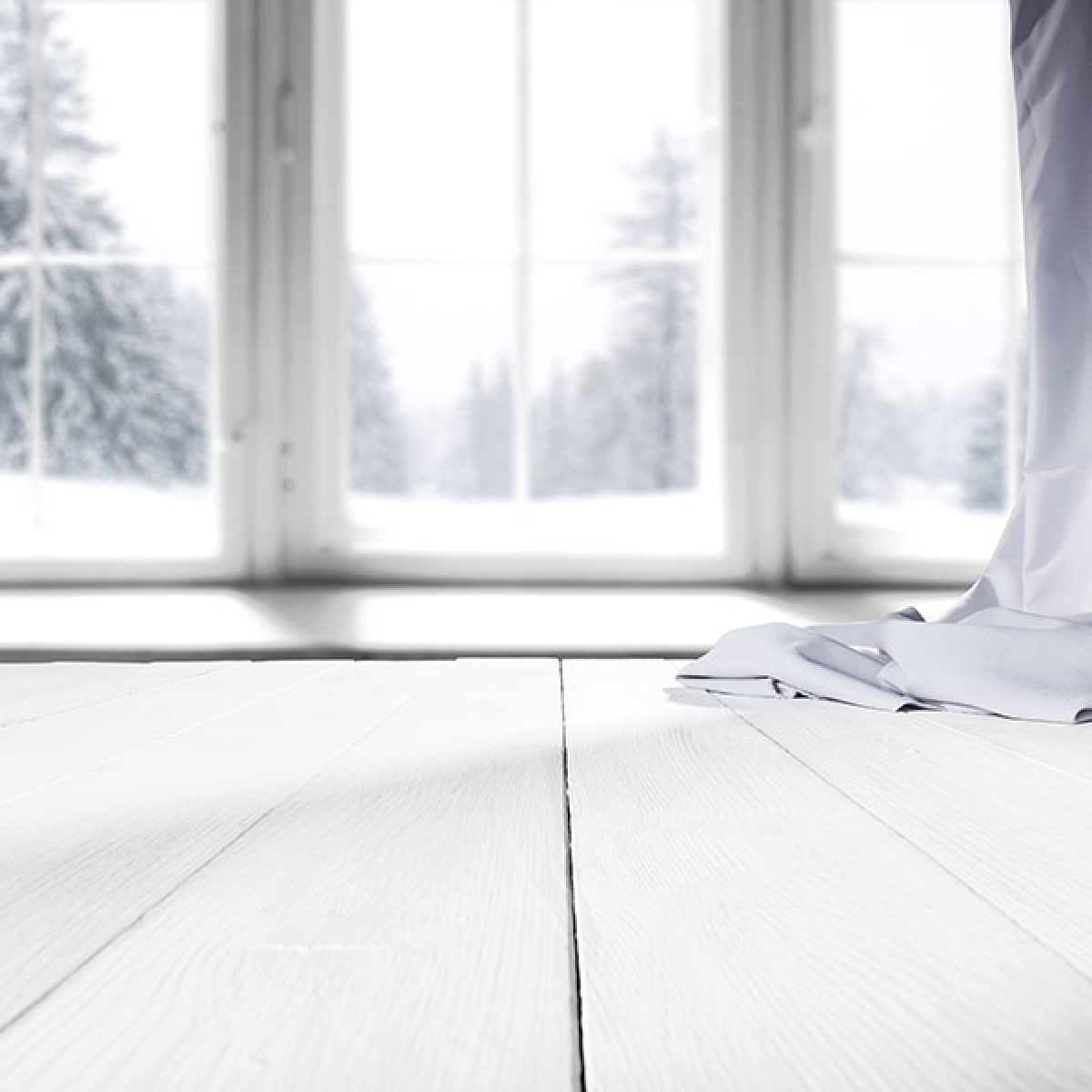 Gap in White Hardwood Flooring During Winter